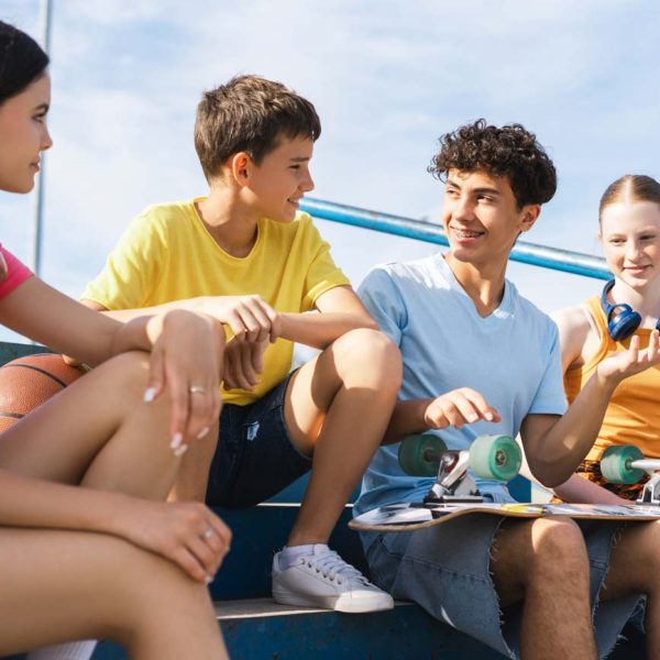 2smiling-teenage-friends-with-skateboard-talking-t-2026-01-08-05-56-55-utc